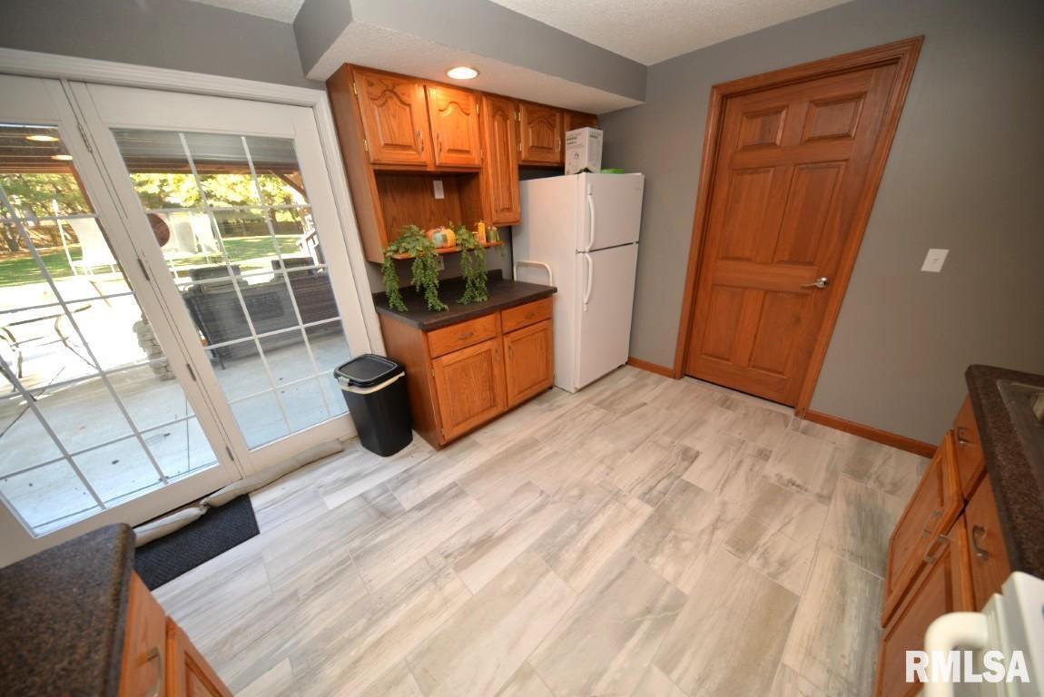 501 Cardinal Drive Mount Vernon, IL 62864 - Photo 41 of 57 a kitchen with stainless steel appliances wooden cabinets and a stove top oven
