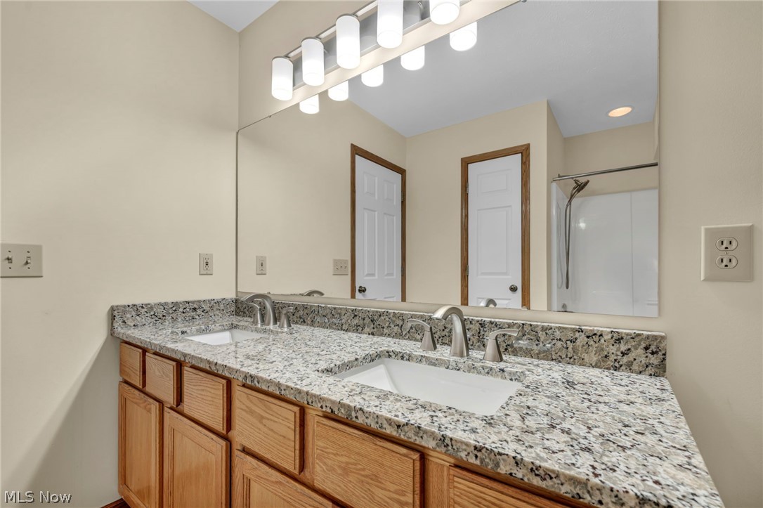 9842 Johnnycake Ridge Road Mentor, OH 44060 - Photo 27 of 40 Double vanity with granite-style countertops and undermount sinks