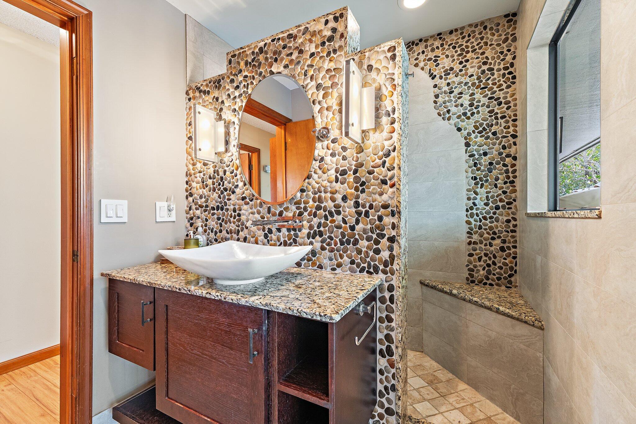 702 Warren Drive Jupiter, FL 33458 - Photo 48 of 76 a bathroom with a granite countertop sink and a mirror