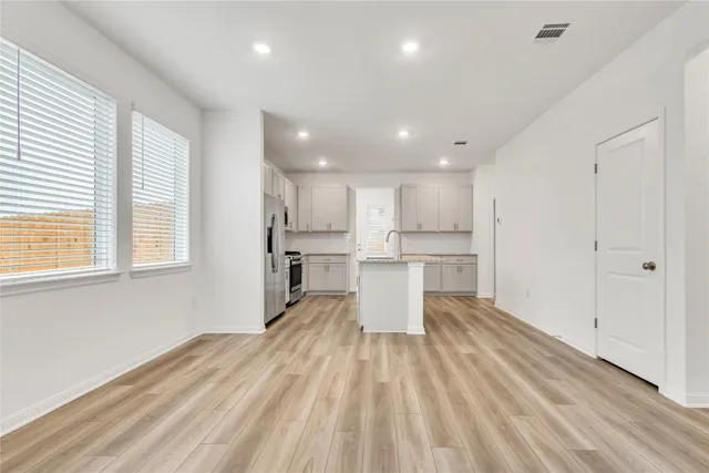 a view of kitchen with wooden floor