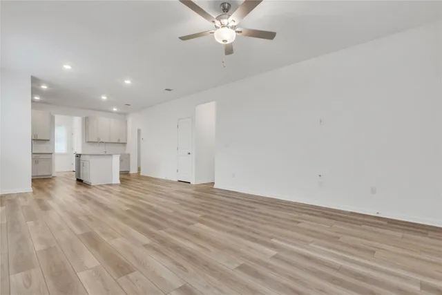 a view of a kitchen with a dishwasher and a refrigerator