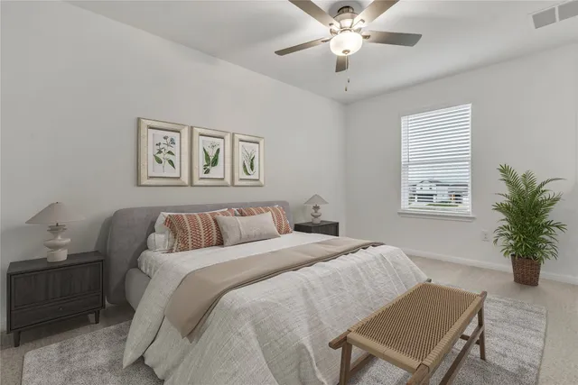 a bed room with a bed and a window