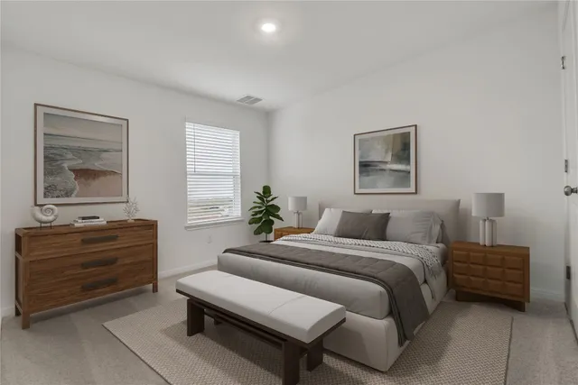 a bedroom with a bed and a dresser