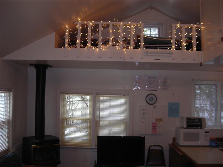 91 Glendon Road, Unit 99 Dennis Port, MA 02639 - Photo 8 of 17 a view of a dining room with furniture and chandelier