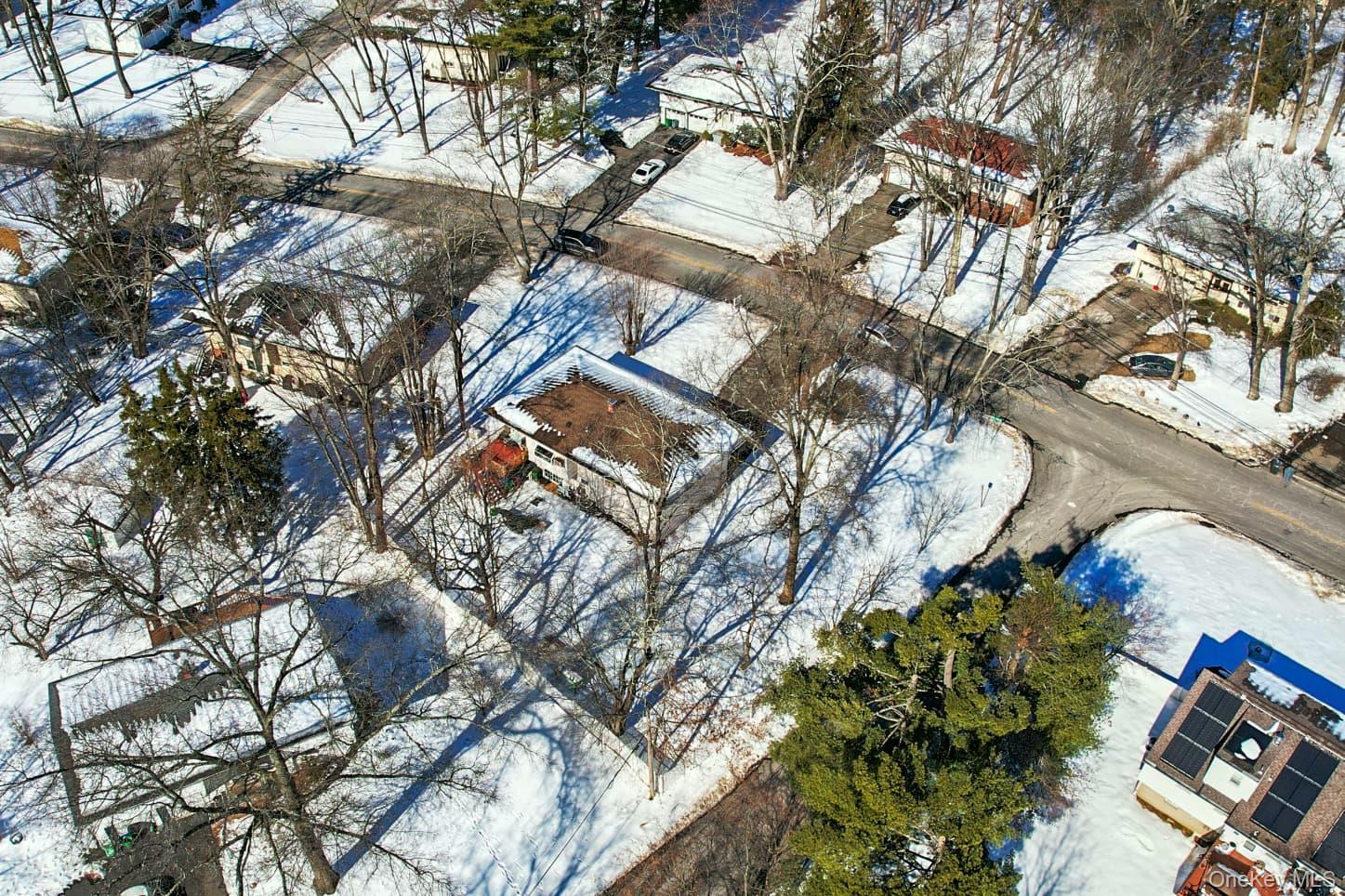 a backyard of a house with outdoor seating