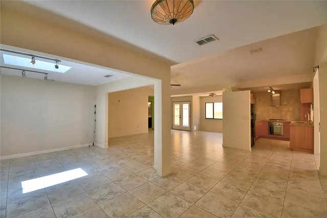 a kitchen with granite countertop a sink and a window