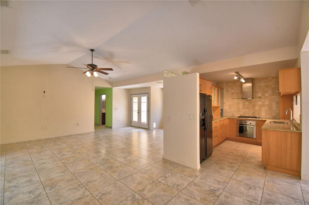 263 Mariposa Winter Haven, FL 33884 - Photo 14 of 69 a view of a kitchen with a sink and a refrigerator