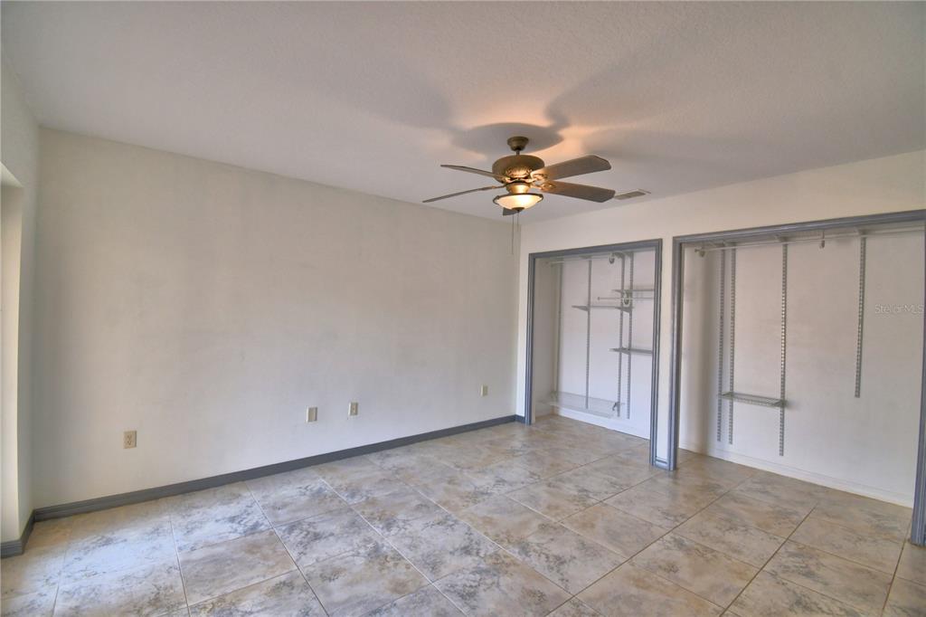 263 Mariposa Winter Haven, FL 33884 - Photo 29 of 69 a view of an empty room with a chandelier fan