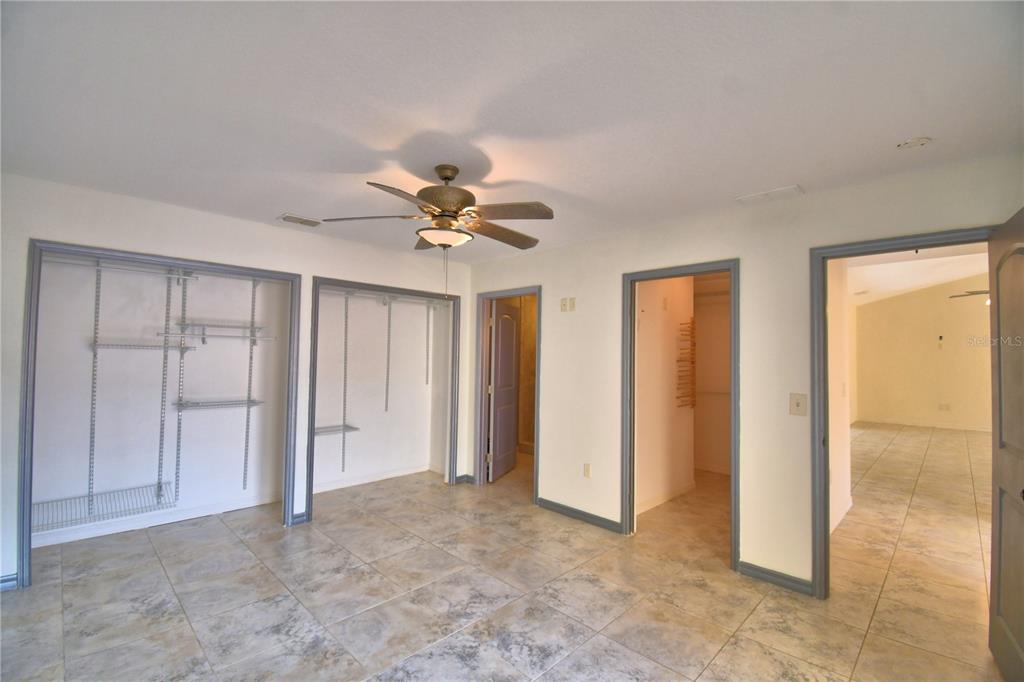 263 Mariposa Winter Haven, FL 33884 - Photo 30 of 69 an empty room with closet and a chandelier fan