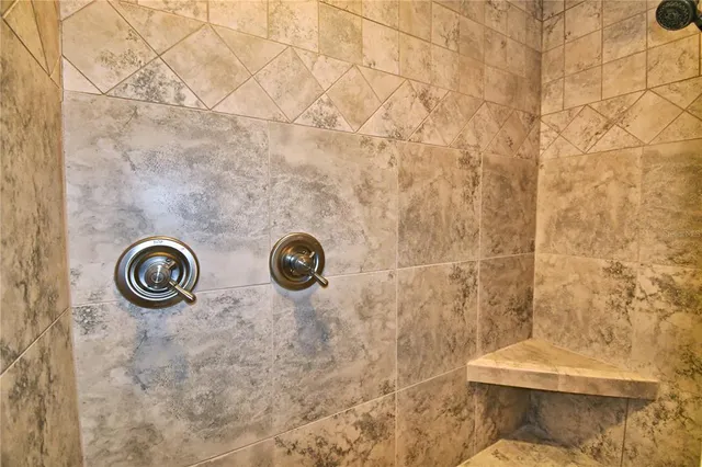 a view of an empty room with a bathroom