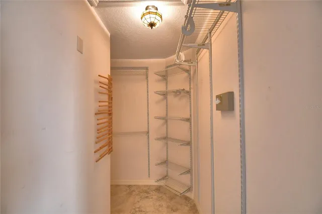 a view of a house with basket ball court and front door