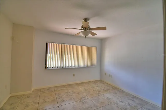 a house that has a tree in front of it