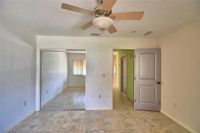 a view of a swimming pool with a chair