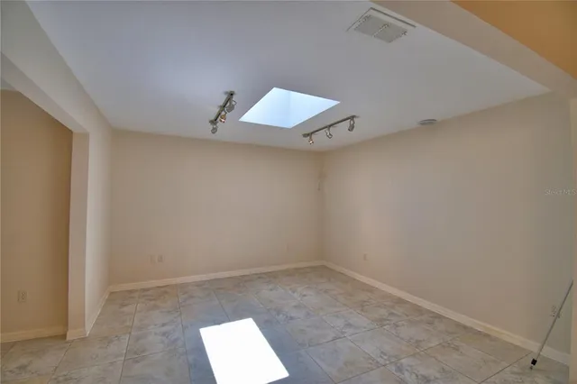 an empty room with a hallway