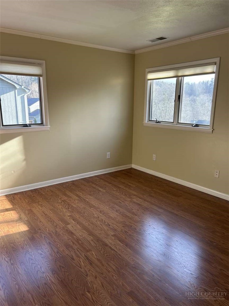 215 Meadow Ridge Road, Unit 19 Boone, NC 28607 - Photo 5 of 6 a view of empty room with wooden floor and fan