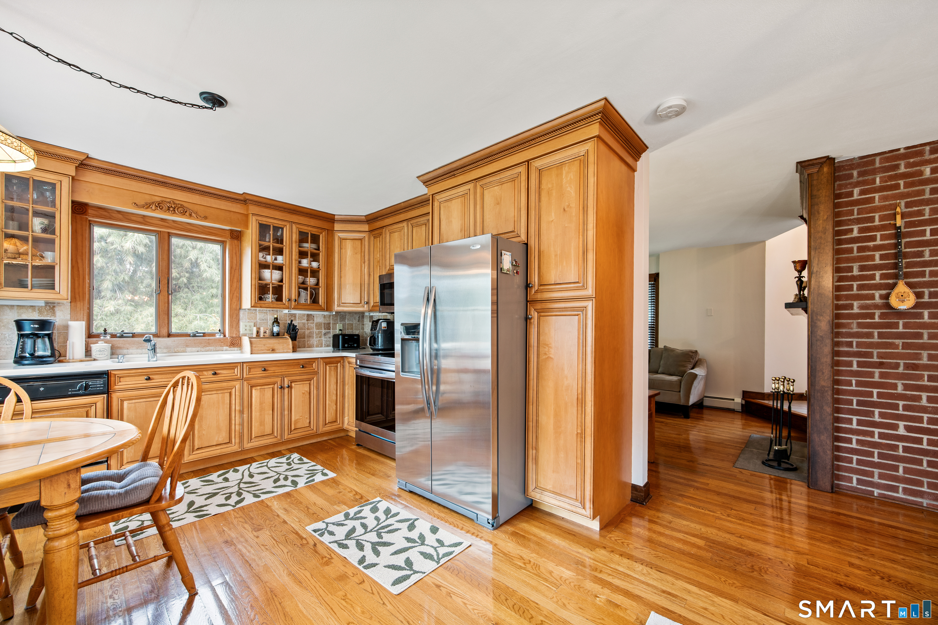 105 Quaker Farms Road Southbury, CT 06488 - Photo 12 of 40 a kitchen with stainless steel appliances granite countertop a refrigerator and a stove top oven