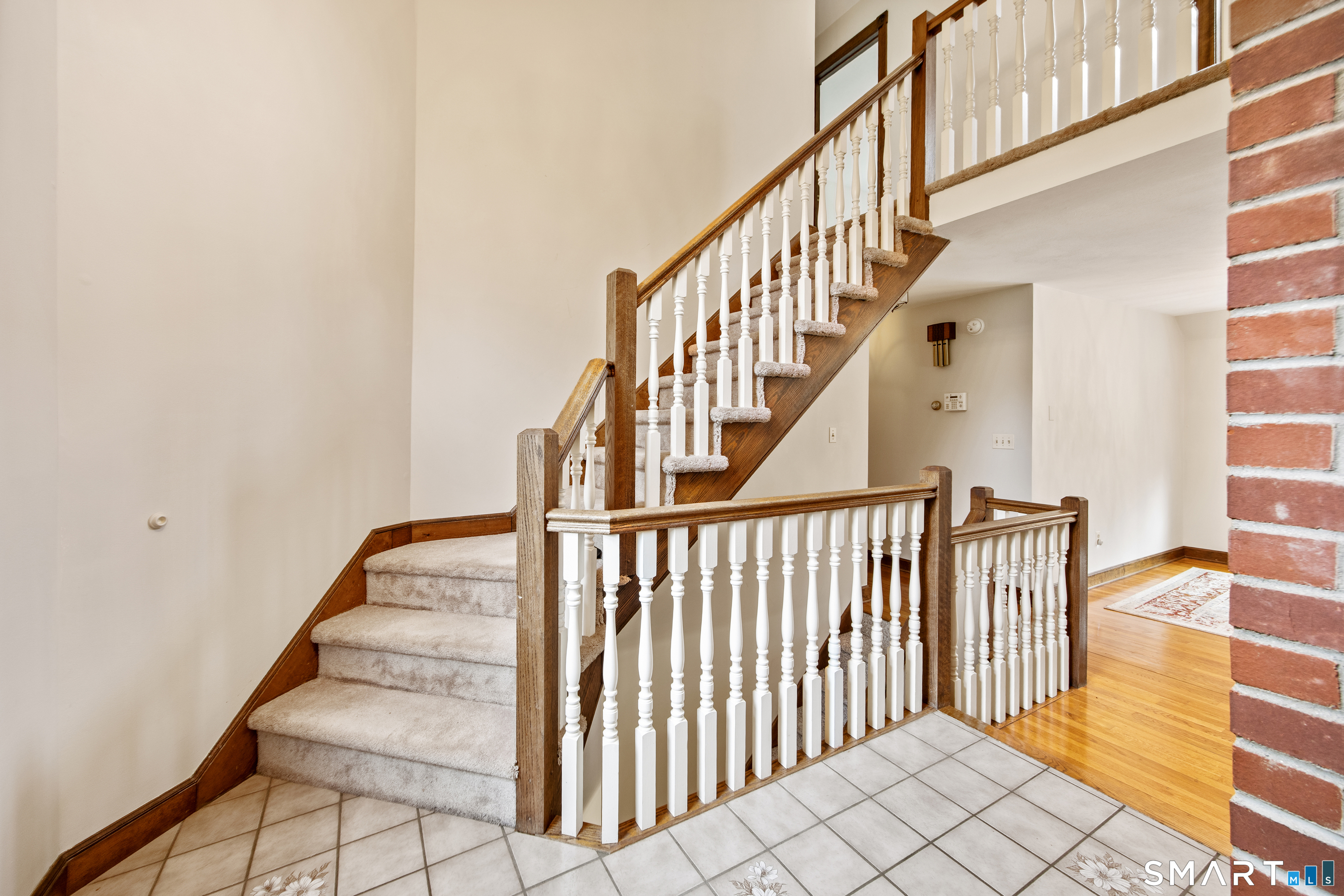 105 Quaker Farms Road Southbury, CT 06488 - Photo 16 of 40 a view of entryway with wooden floor and stairs