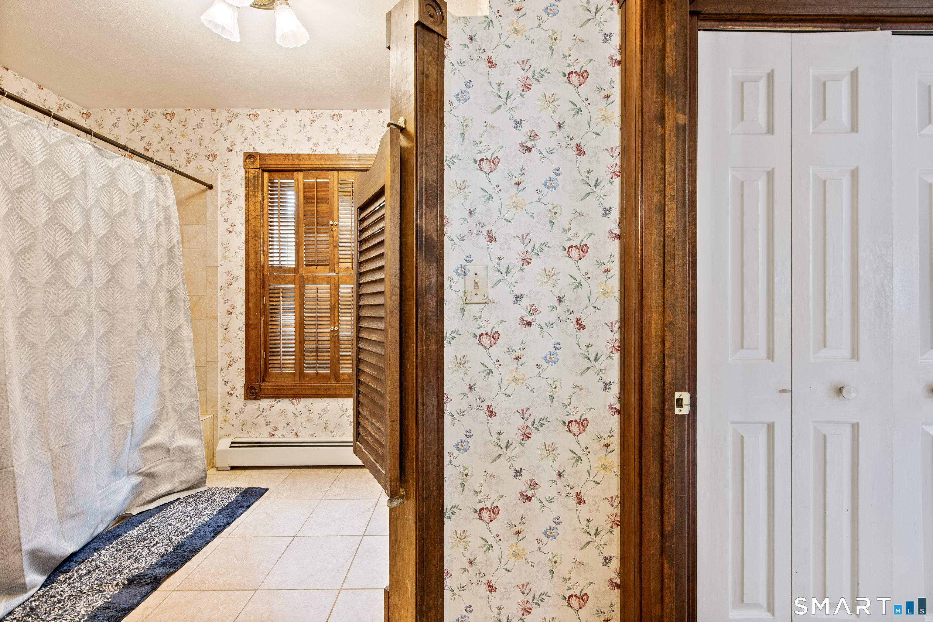 105 Quaker Farms Road Southbury, CT 06488 - Photo 20 of 40 a view of a bathroom with a shower curtain