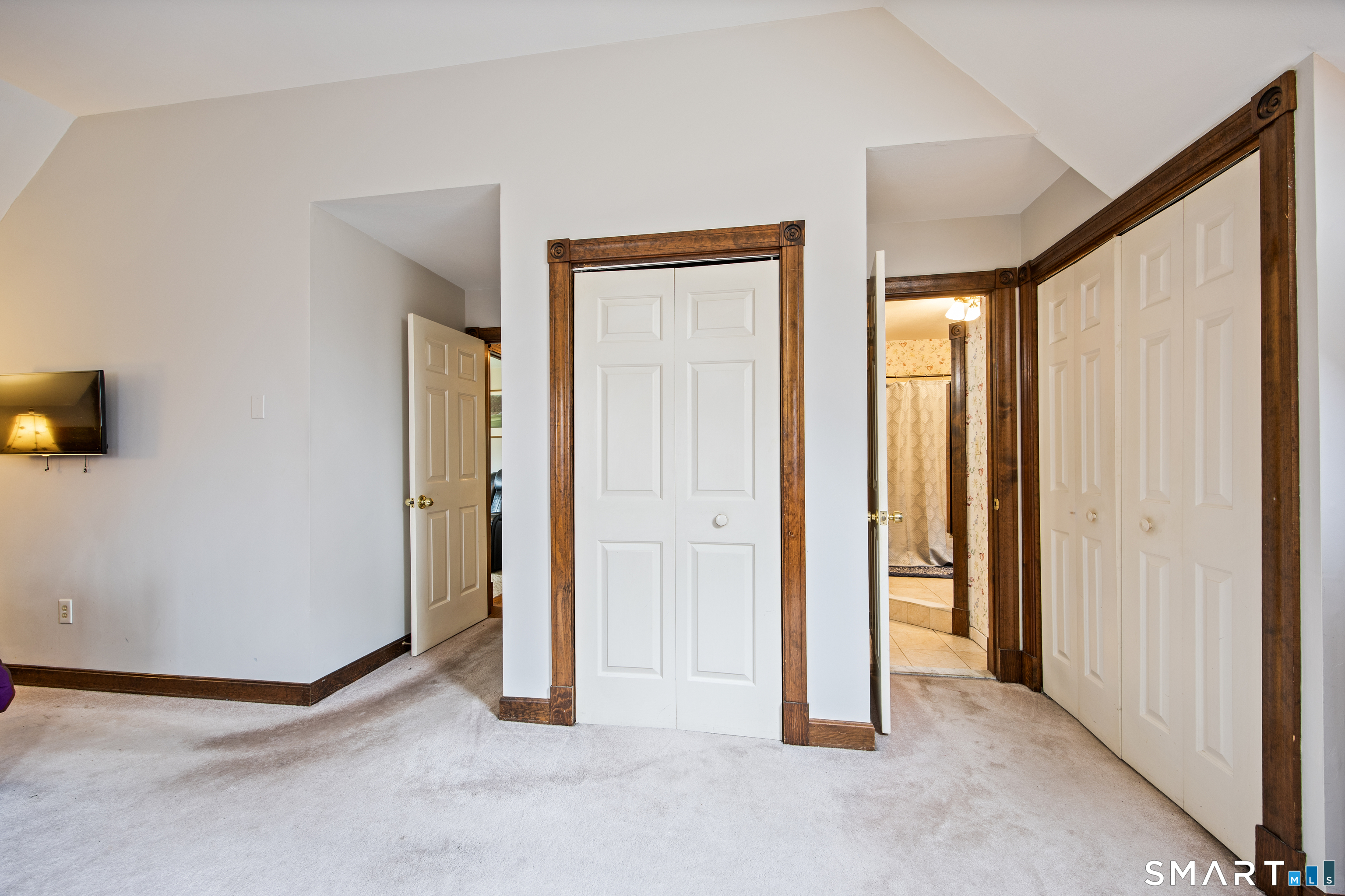 105 Quaker Farms Road Southbury, CT 06488 - Photo 21 of 40 an empty room with windows and closet