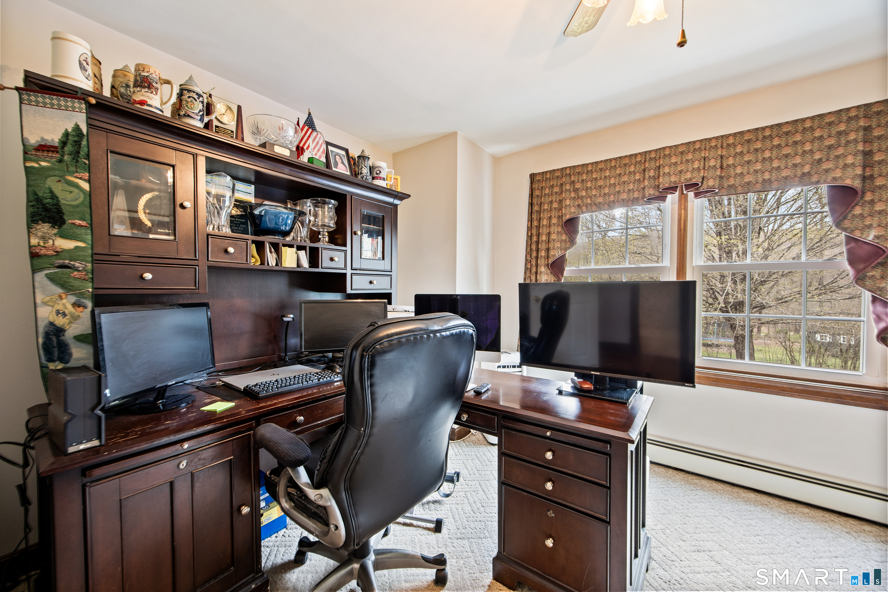 105 Quaker Farms Road Southbury, CT 06488 - Photo 23 of 40 a view of a workspace with furniture and a window