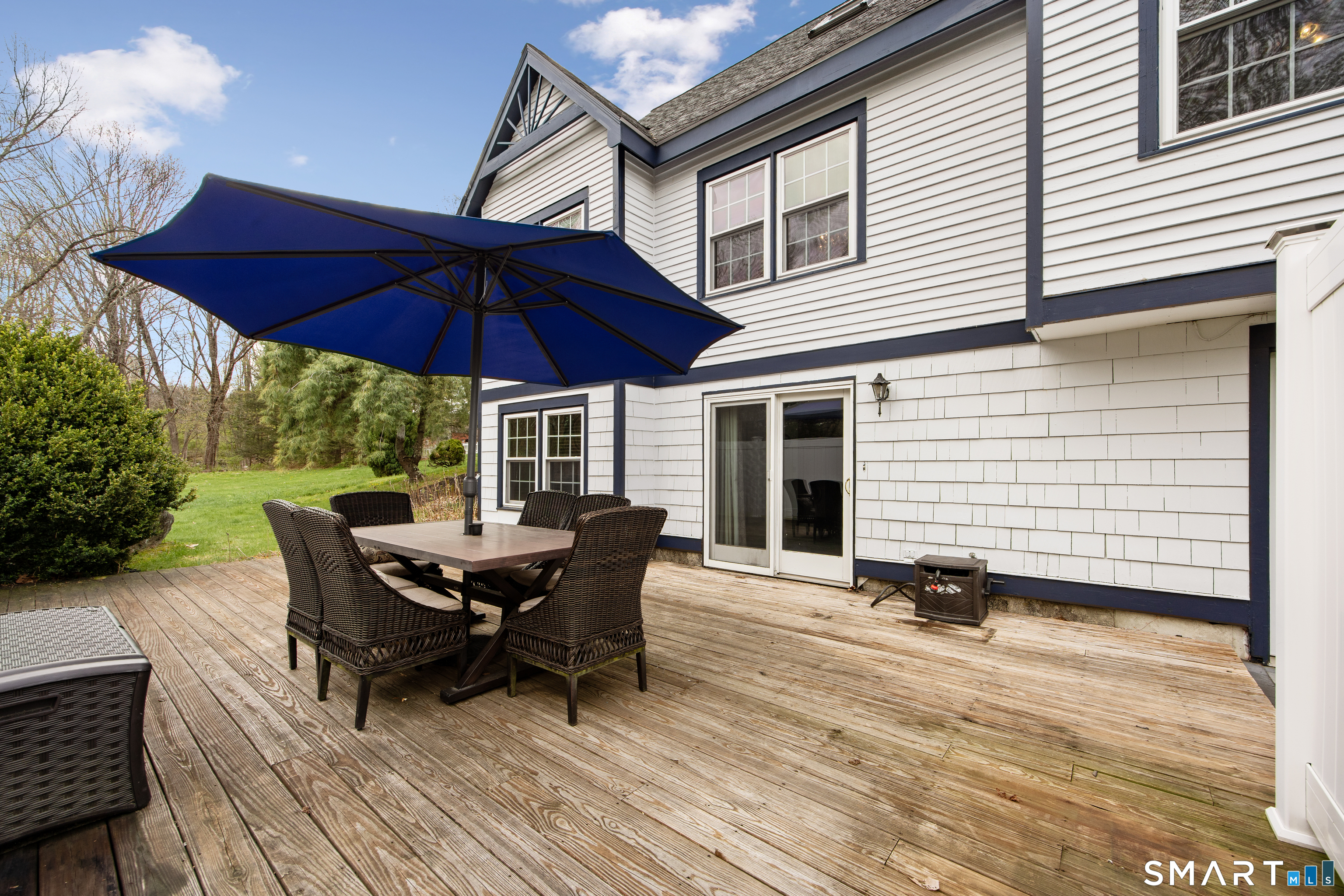 105 Quaker Farms Road Southbury, CT 06488 - Photo 36 of 40 a view of a house with backyard and sitting area
