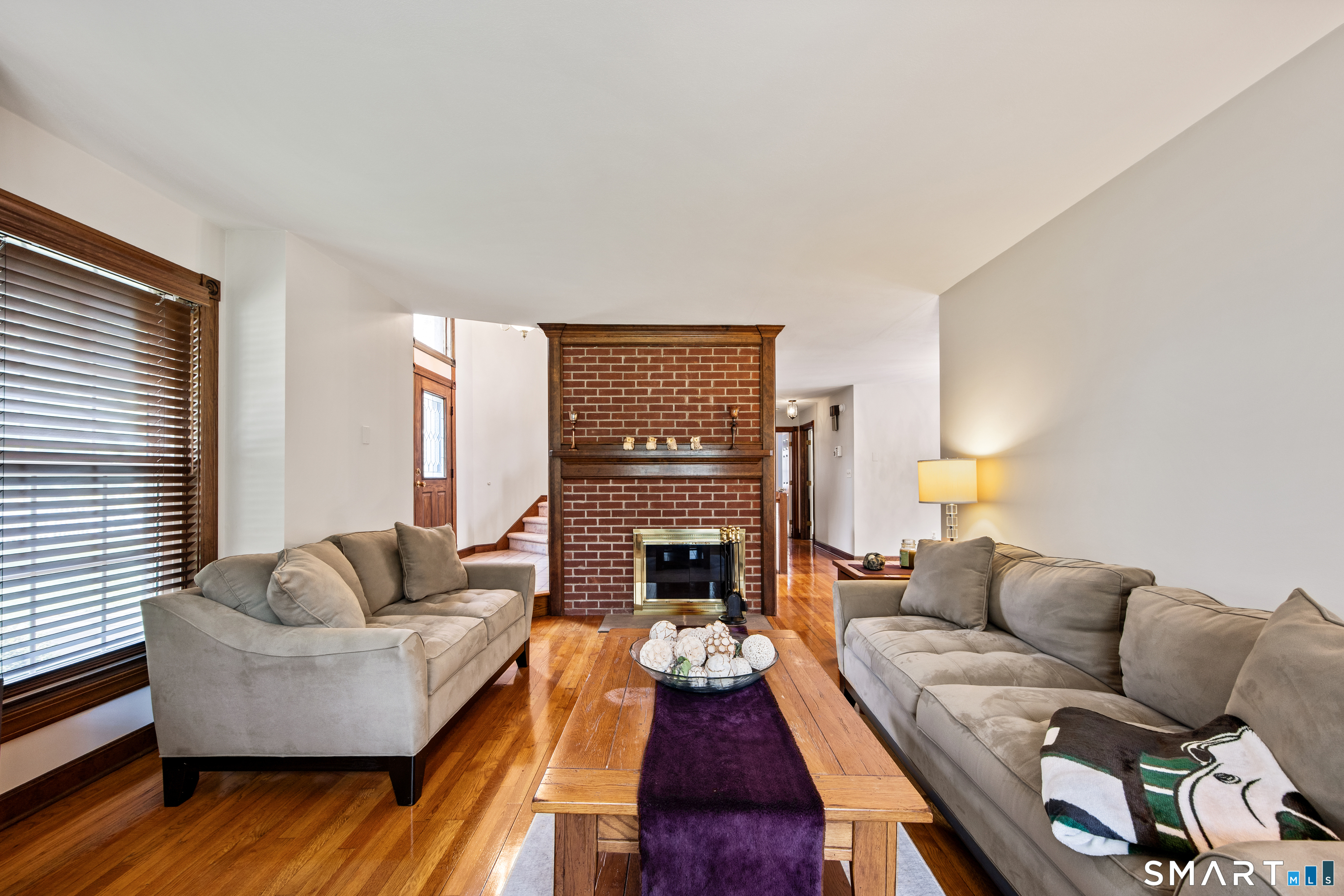 105 Quaker Farms Road Southbury, CT 06488 - Photo 7 of 40 a living room with furniture and a fireplace