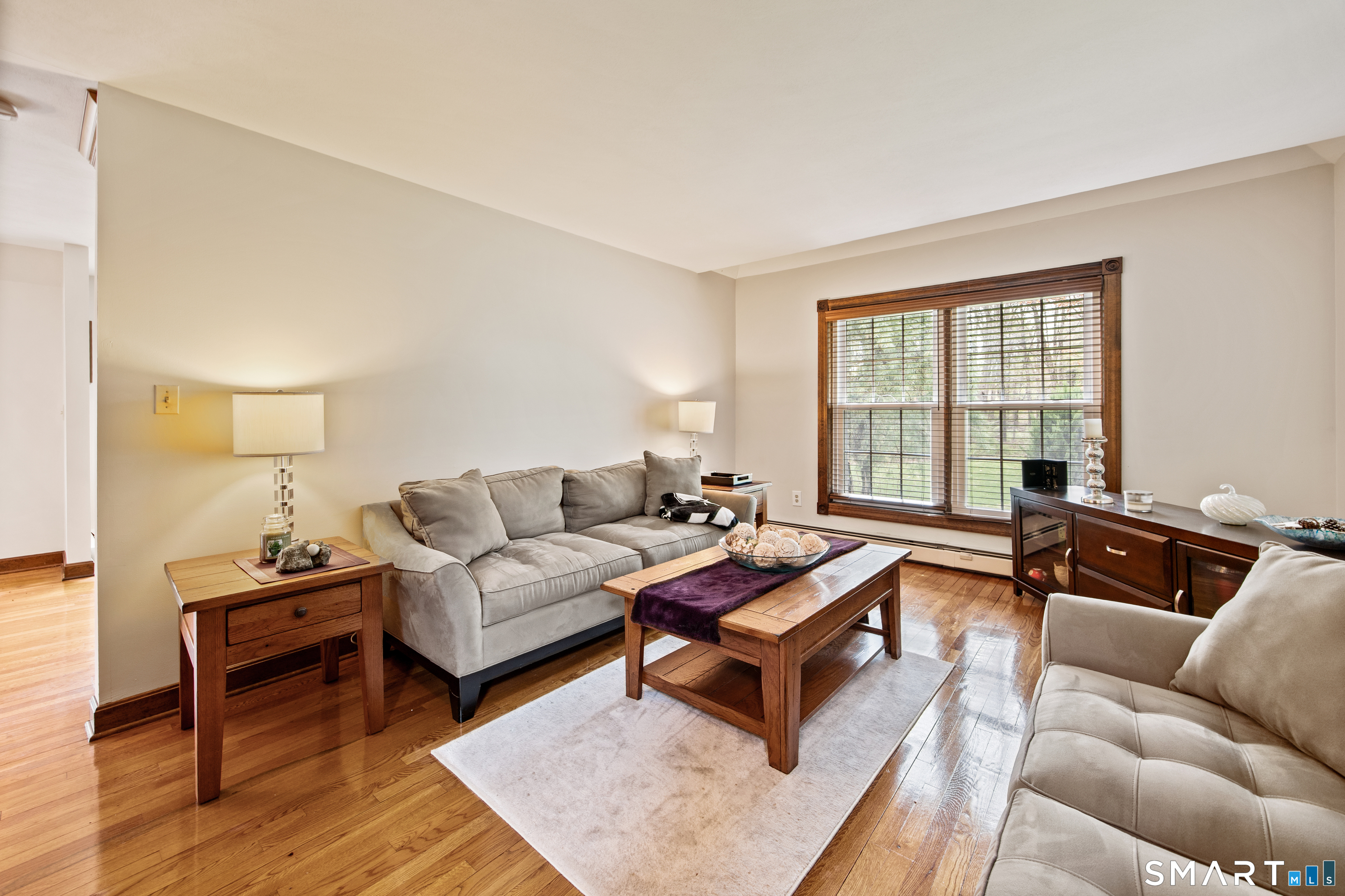 105 Quaker Farms Road Southbury, CT 06488 - Photo 9 of 40 a living room with furniture and a window