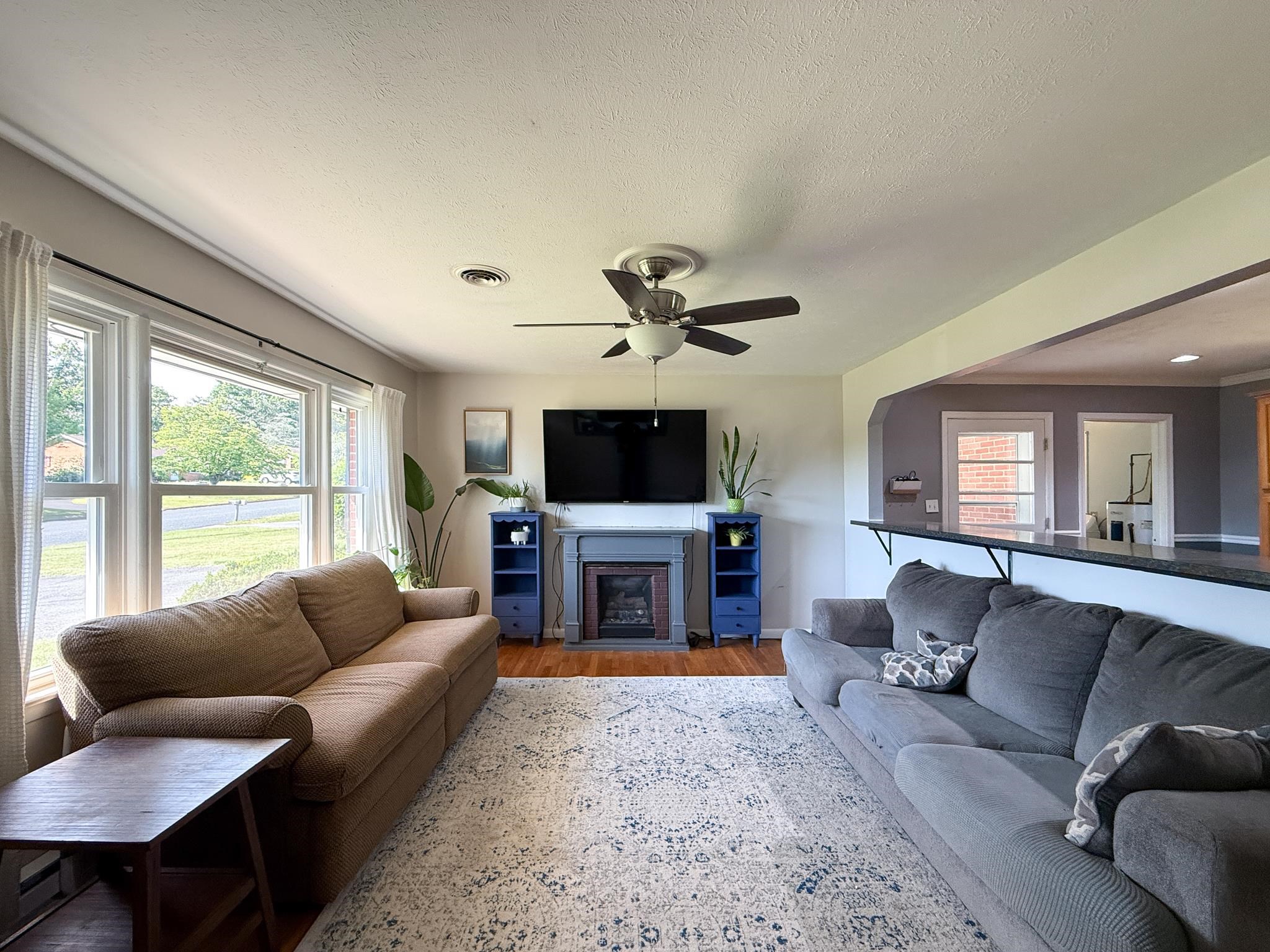 39 View Drive Stuarts Draft, VA 24477 - Photo 16 of 25 a living room with furniture a flat screen tv and a large window