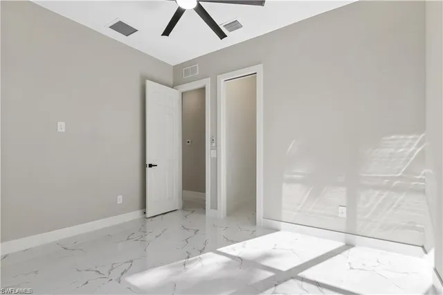 a view of a hallway with wooden shelves