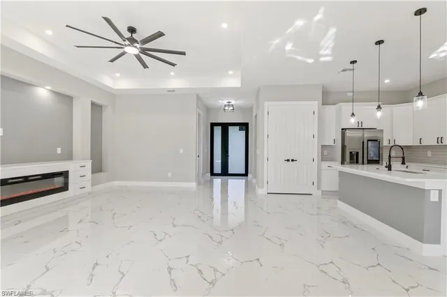 a view of a kitchen with a sink and a window