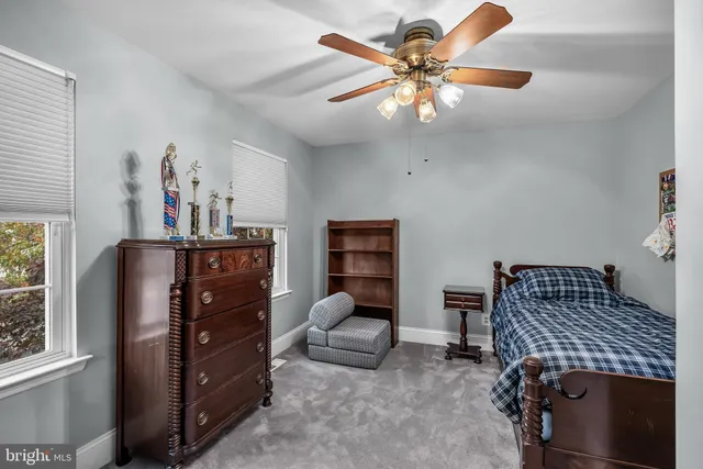 a bedroom with furniture and a window
