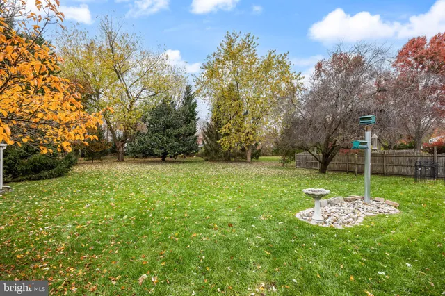 a view of a barn in the middle of a yard