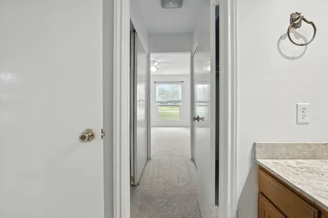 a bathroom with a sink toilet vanity and shower