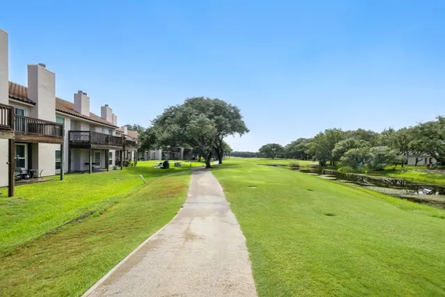 a view of an apartment with a table and chairs