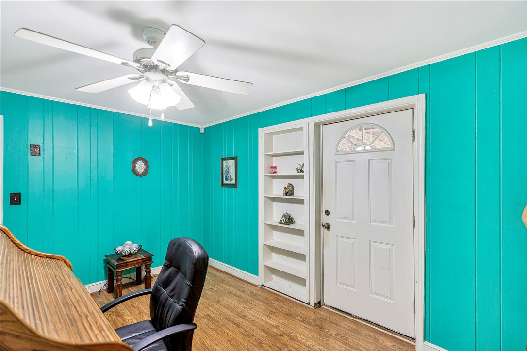 219 Beaty Square Anderson, SC 29624 - Photo 13 of 32 This versatile room features warm flooring, built-in shelving, and a bright door.