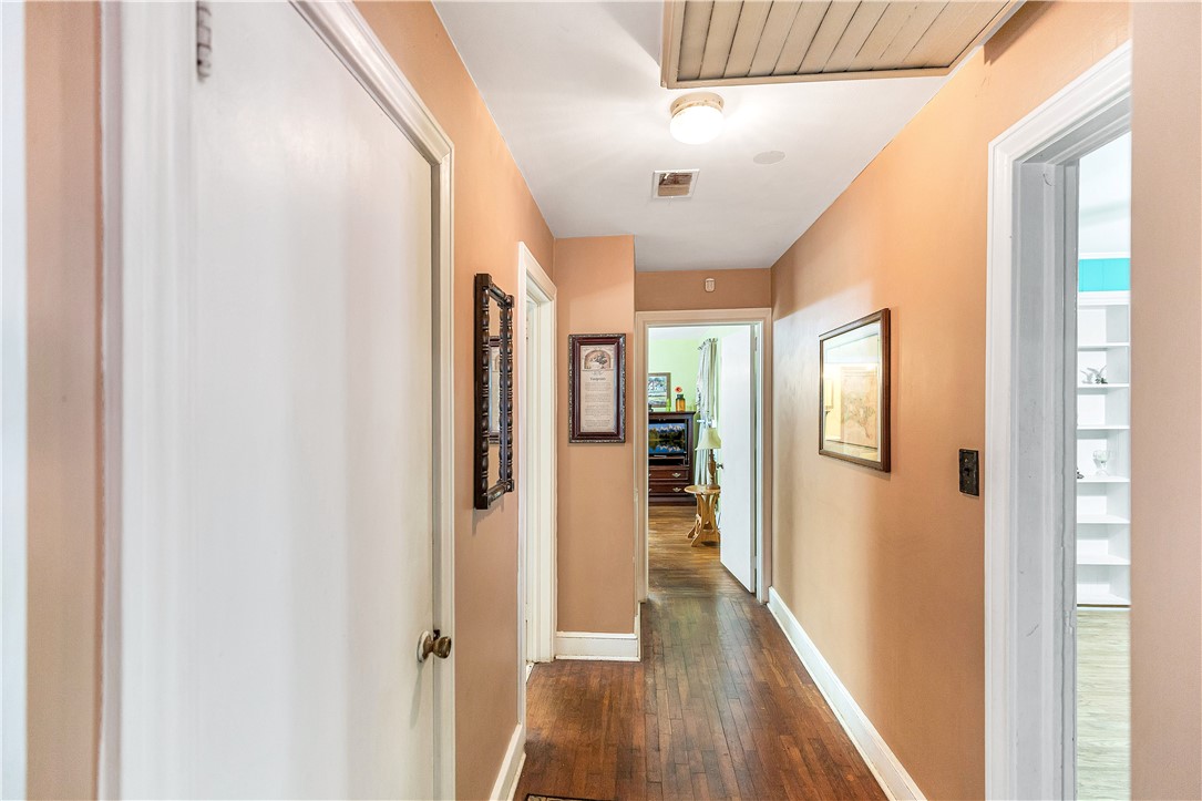 219 Beaty Square Anderson, SC 29624 - Photo 15 of 32 This interior hallway features rich hardwood flooring, creating a warm and inviting atmosphere.