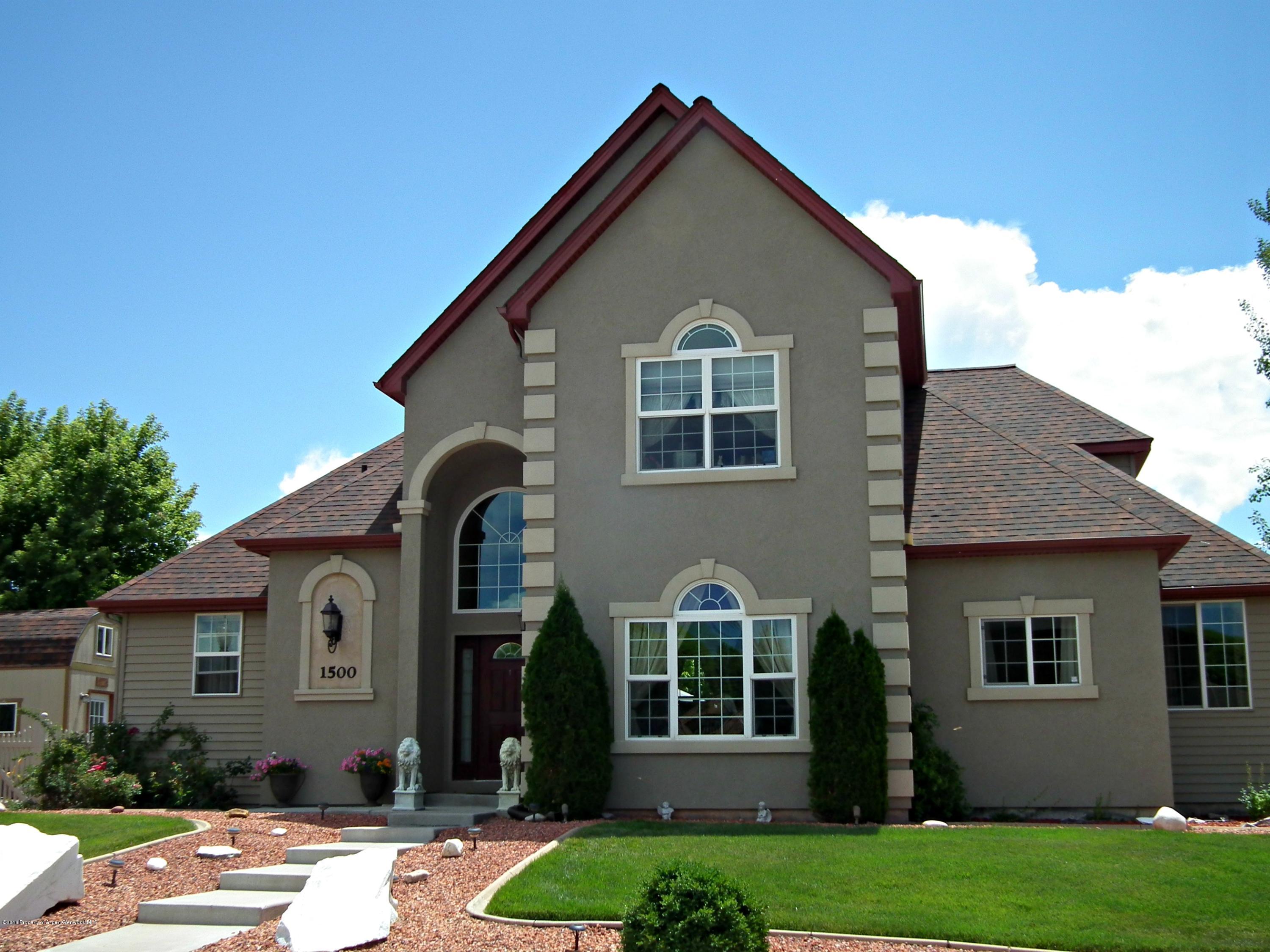 1500 Fir Court Rifle, CO 81650 - Photo 1 of 31 a front view of a house with a yard
