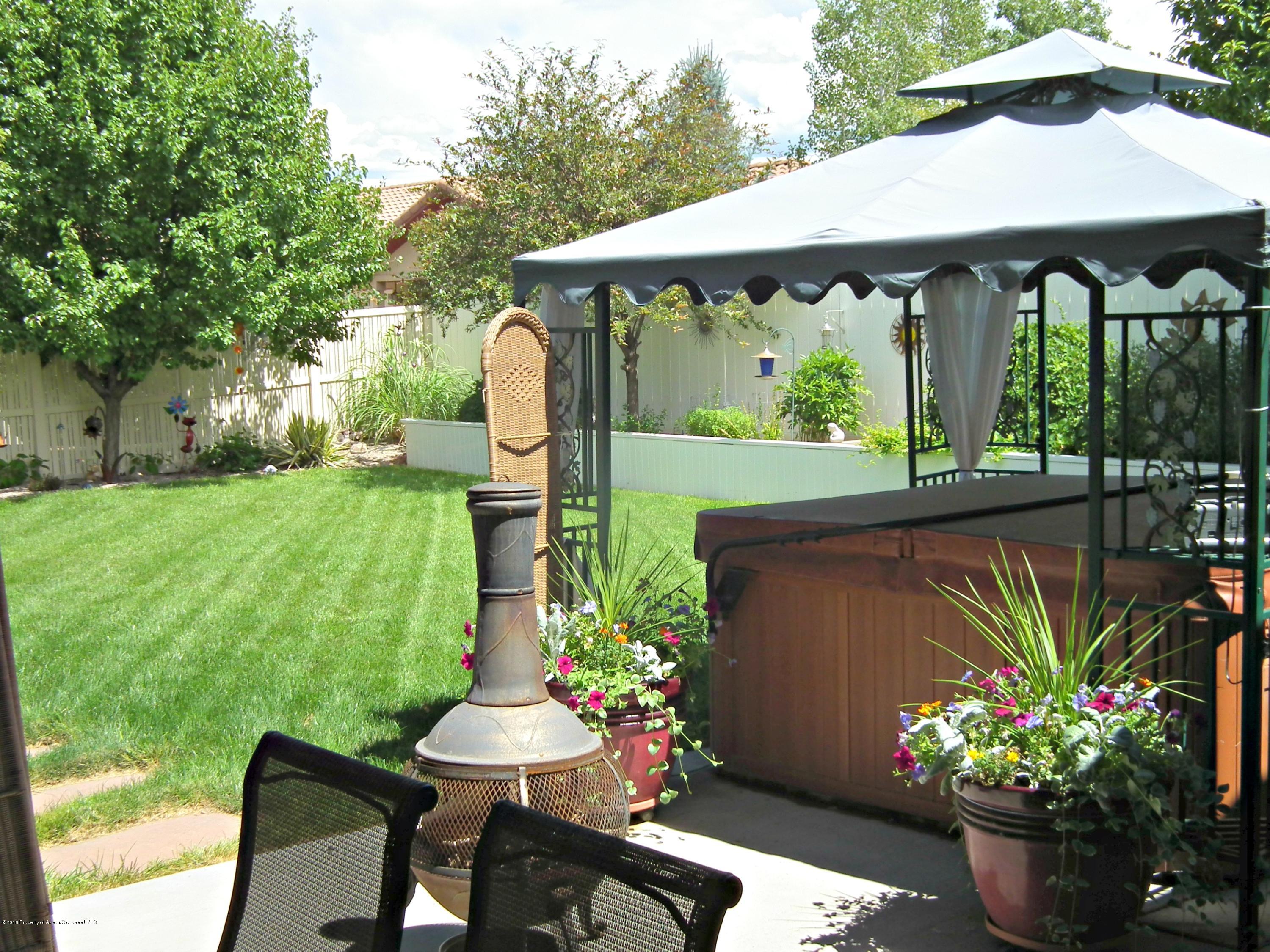 1500 Fir Court Rifle, CO 81650 - Photo 25 of 31 a patio with table and chairs and a potted plants