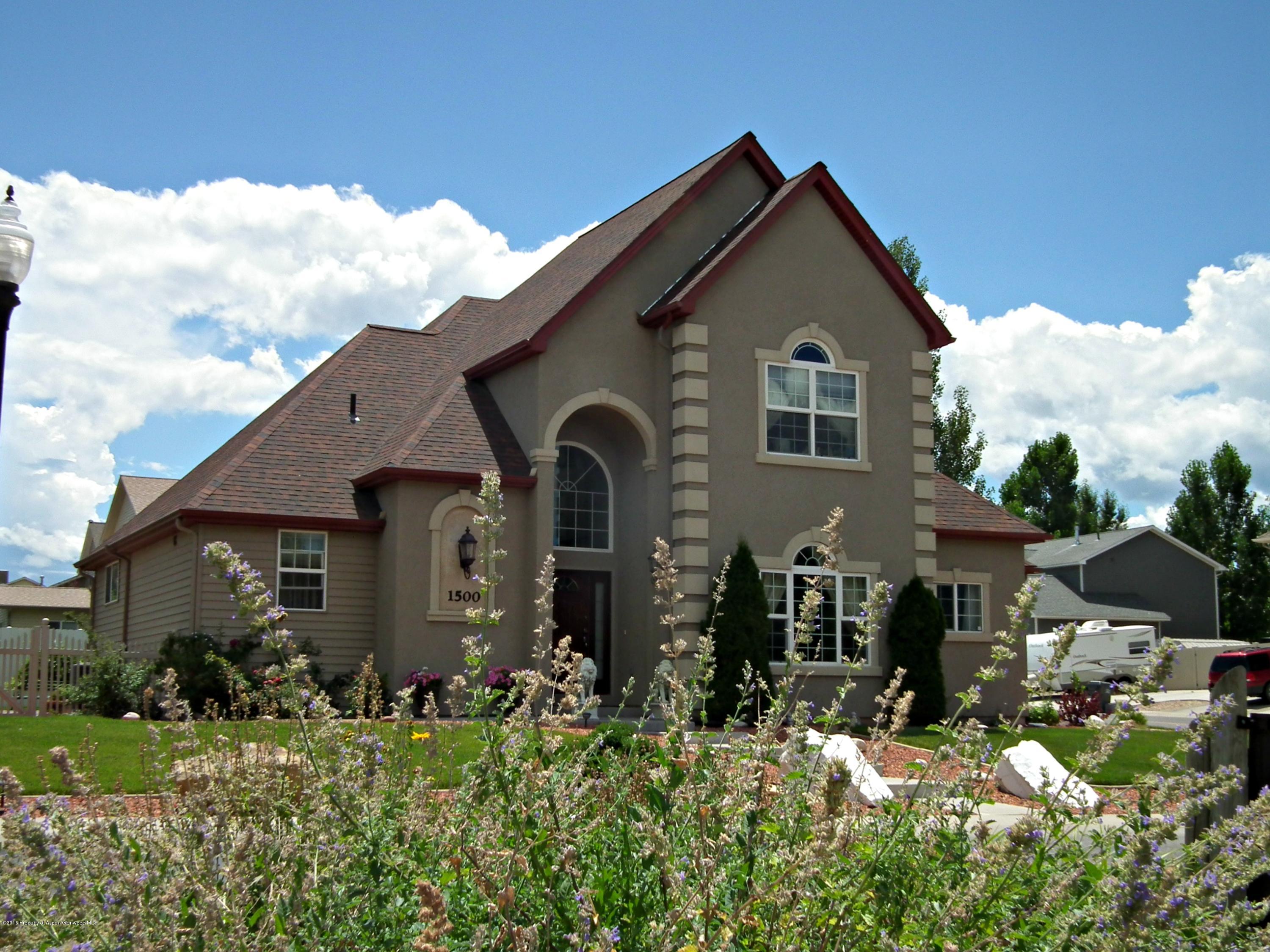 1500 Fir Court Rifle, CO 81650 - Photo 3 of 31 a front view of a house with a yard