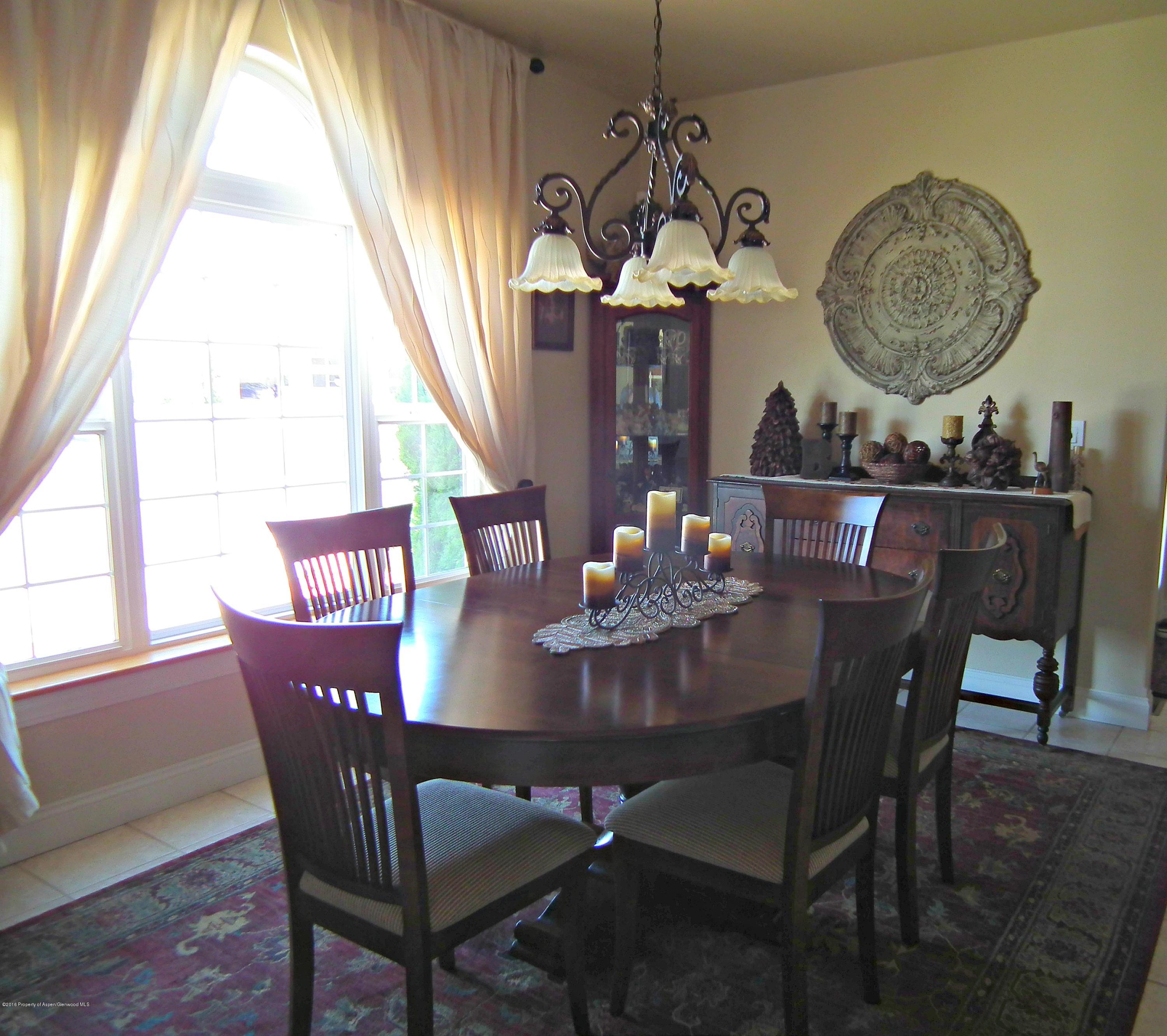 1500 Fir Court Rifle, CO 81650 - Photo 8 of 31 a view of a dining room with furniture window and outside view