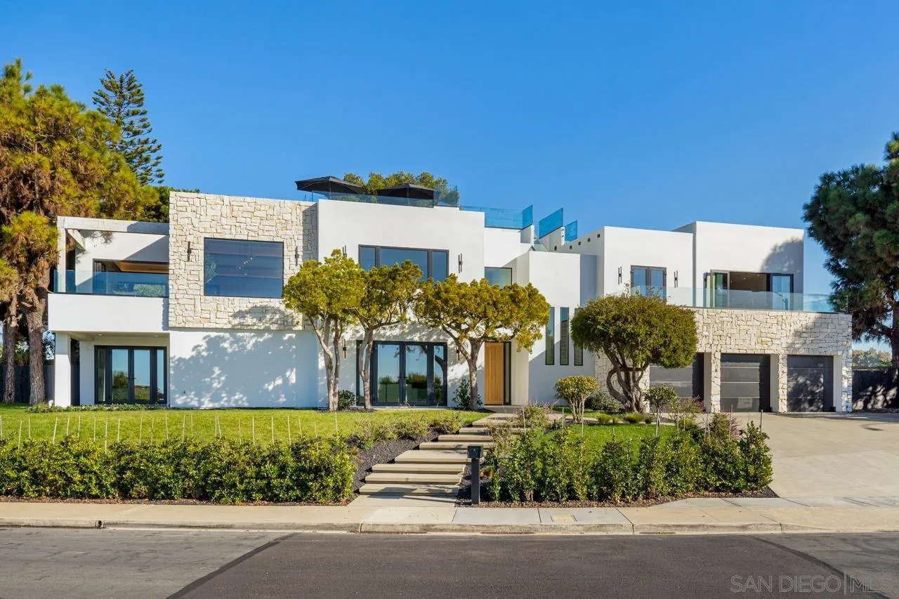 8433 Prestwick Drive La Jolla, CA 92037 - Photo 2 of 74 a front view of a building with a garden