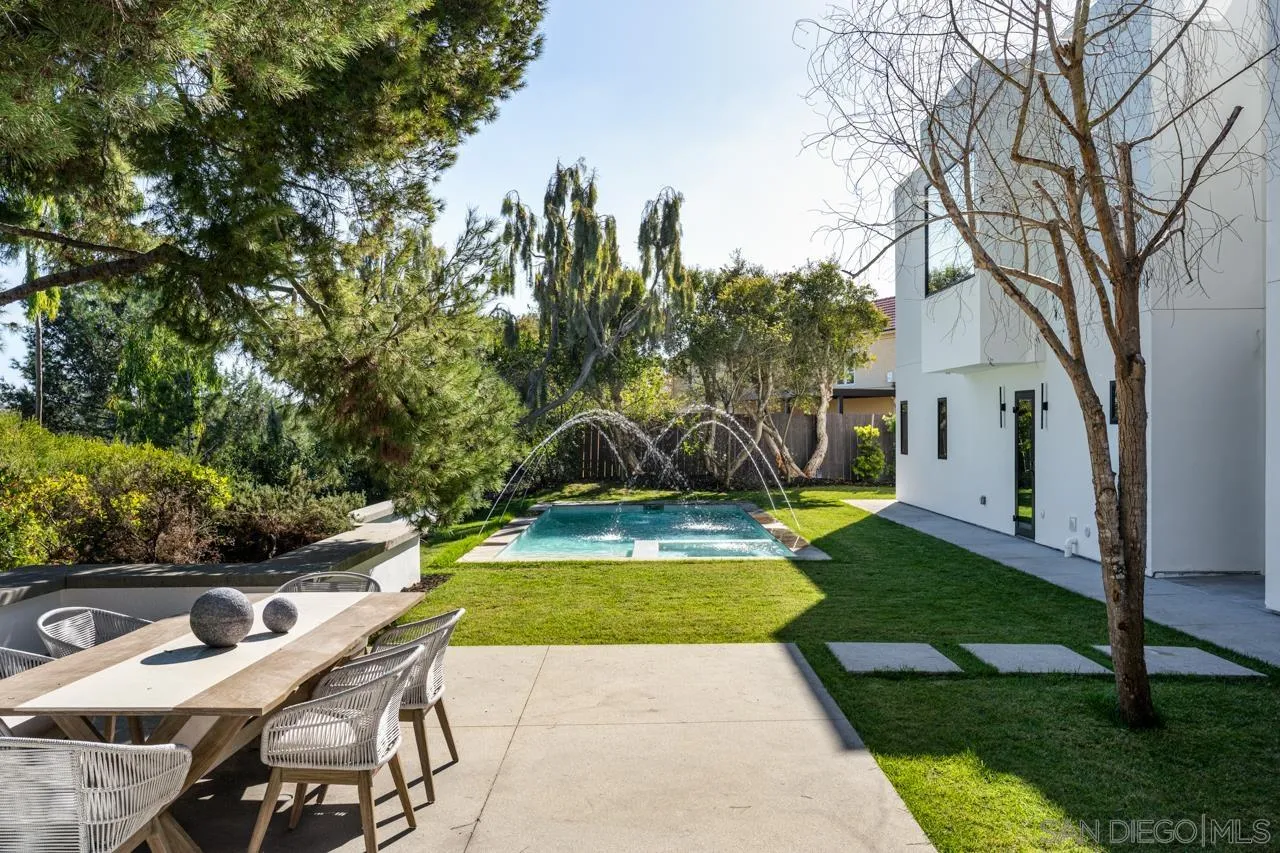8433 Prestwick Drive La Jolla, CA 92037 - Photo 26 of 74 a view of a patio with a table chairs and a fire pit
