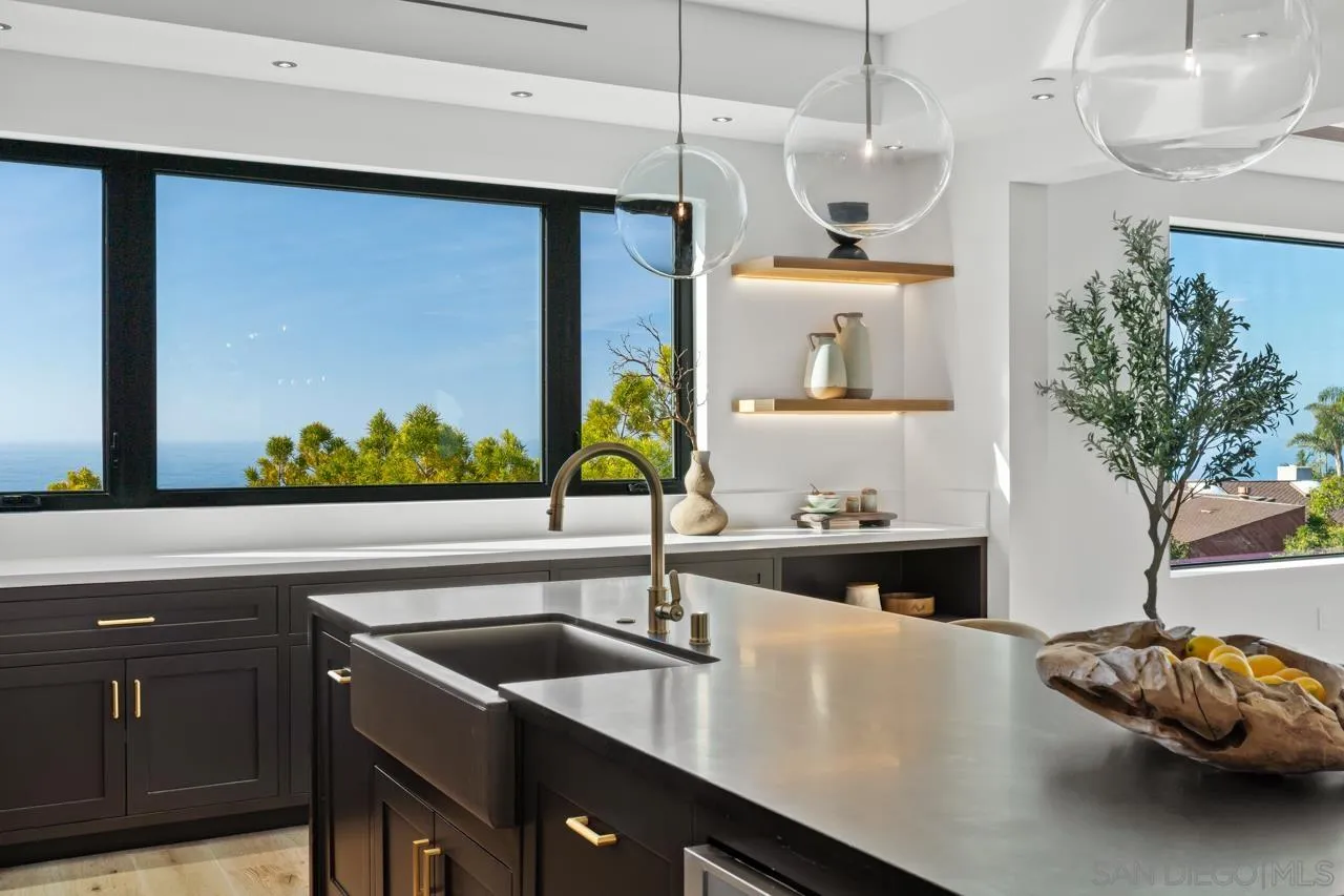 8433 Prestwick Drive La Jolla, CA 92037 - Photo 39 of 74 a kitchen with a sink and a stove top oven