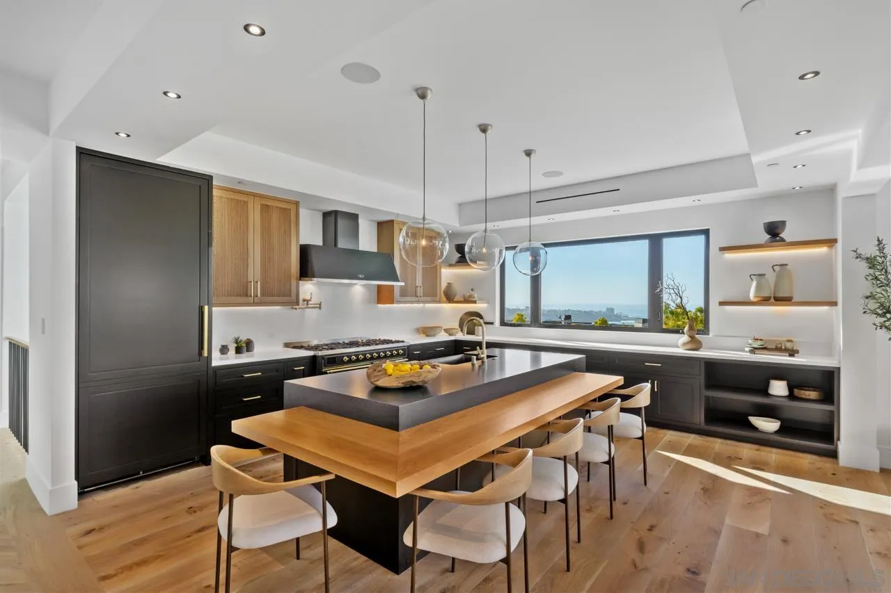 8433 Prestwick Drive La Jolla, CA 92037 - Photo 44 of 74 a kitchen with a table and chairs in it
