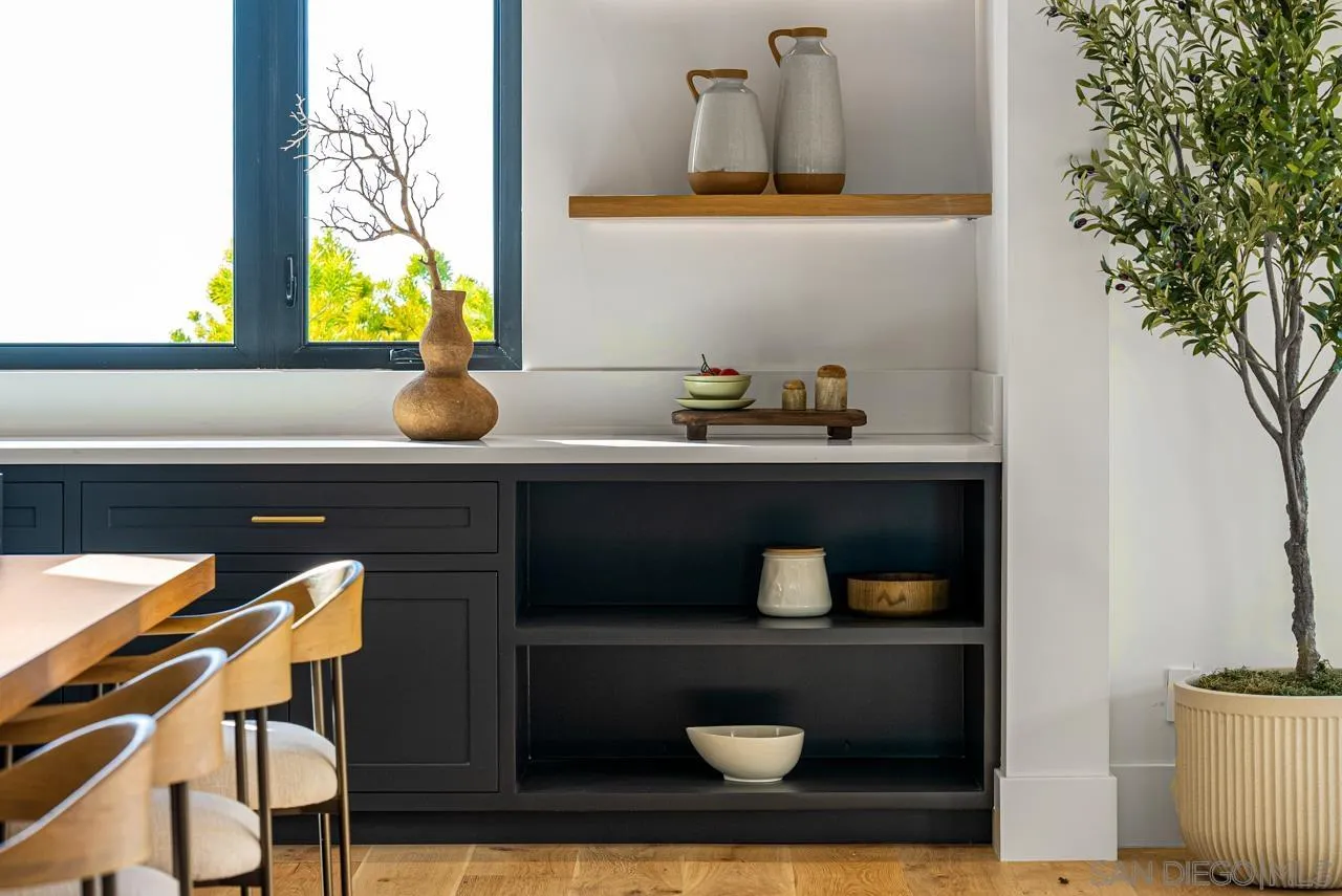 8433 Prestwick Drive La Jolla, CA 92037 - Photo 49 of 74 a bathroom with a sink and a mirror