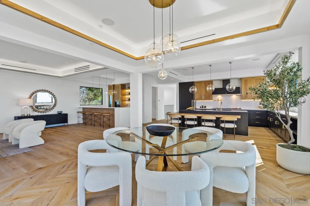 8433 Prestwick Drive La Jolla, CA 92037 - Photo 50 of 74 a living room with fireplace furniture and a chandelier