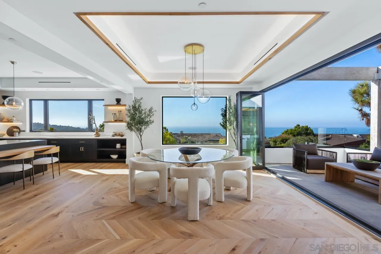 8433 Prestwick Drive La Jolla, CA 92037 - Photo 53 of 74 a living room with furniture and a chandelier
