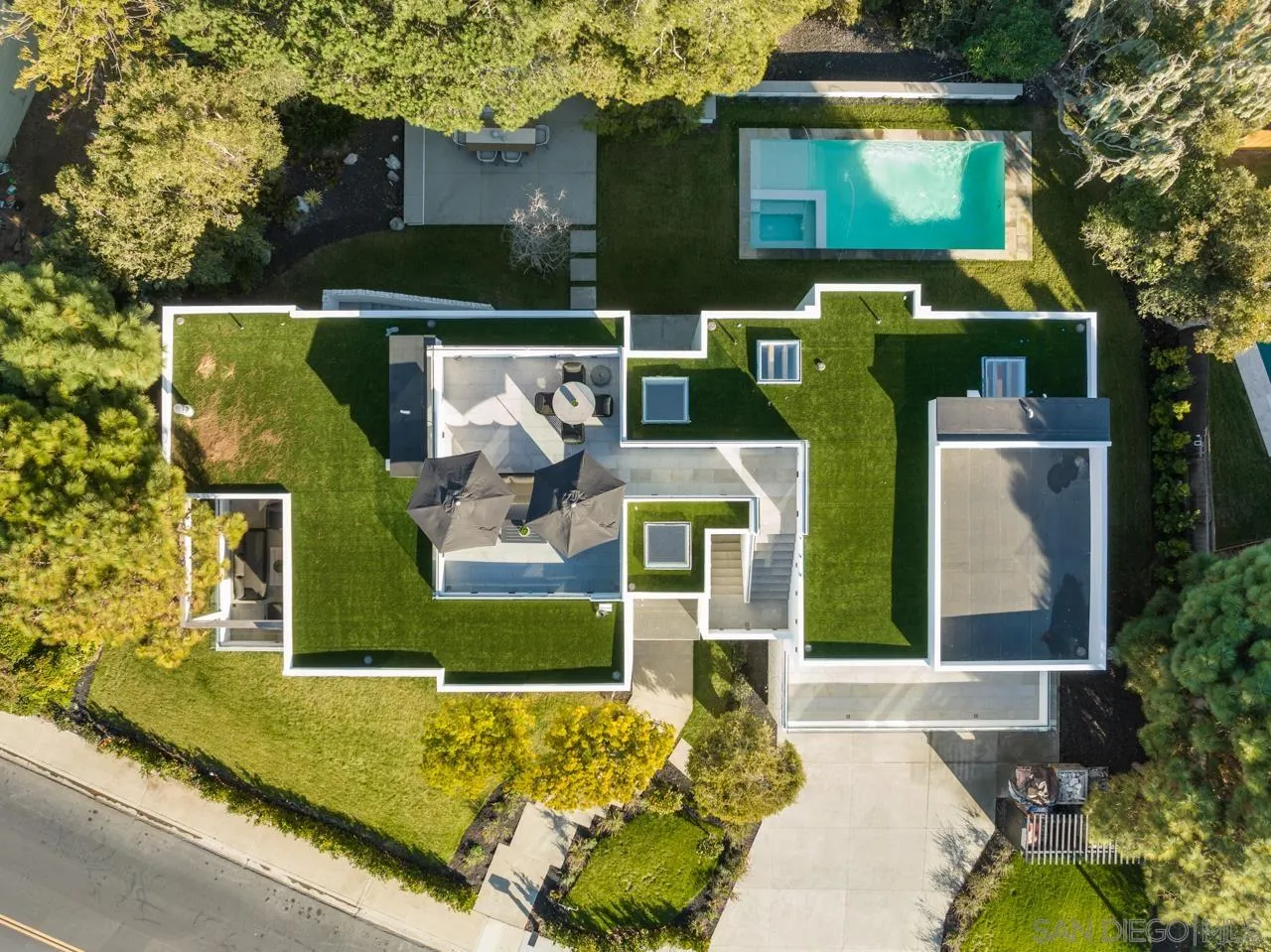 8433 Prestwick Drive La Jolla, CA 92037 - Photo 69 of 74 a front view of a house with outdoor seating yard and green space