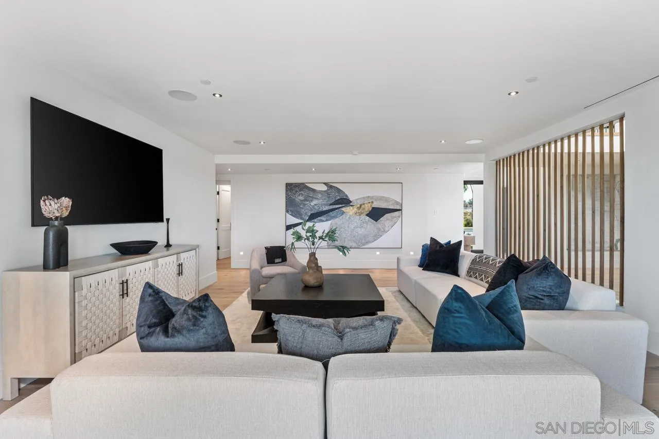 8433 Prestwick Drive La Jolla, CA 92037 - Photo 9 of 74 a living room with furniture and a flat screen tv