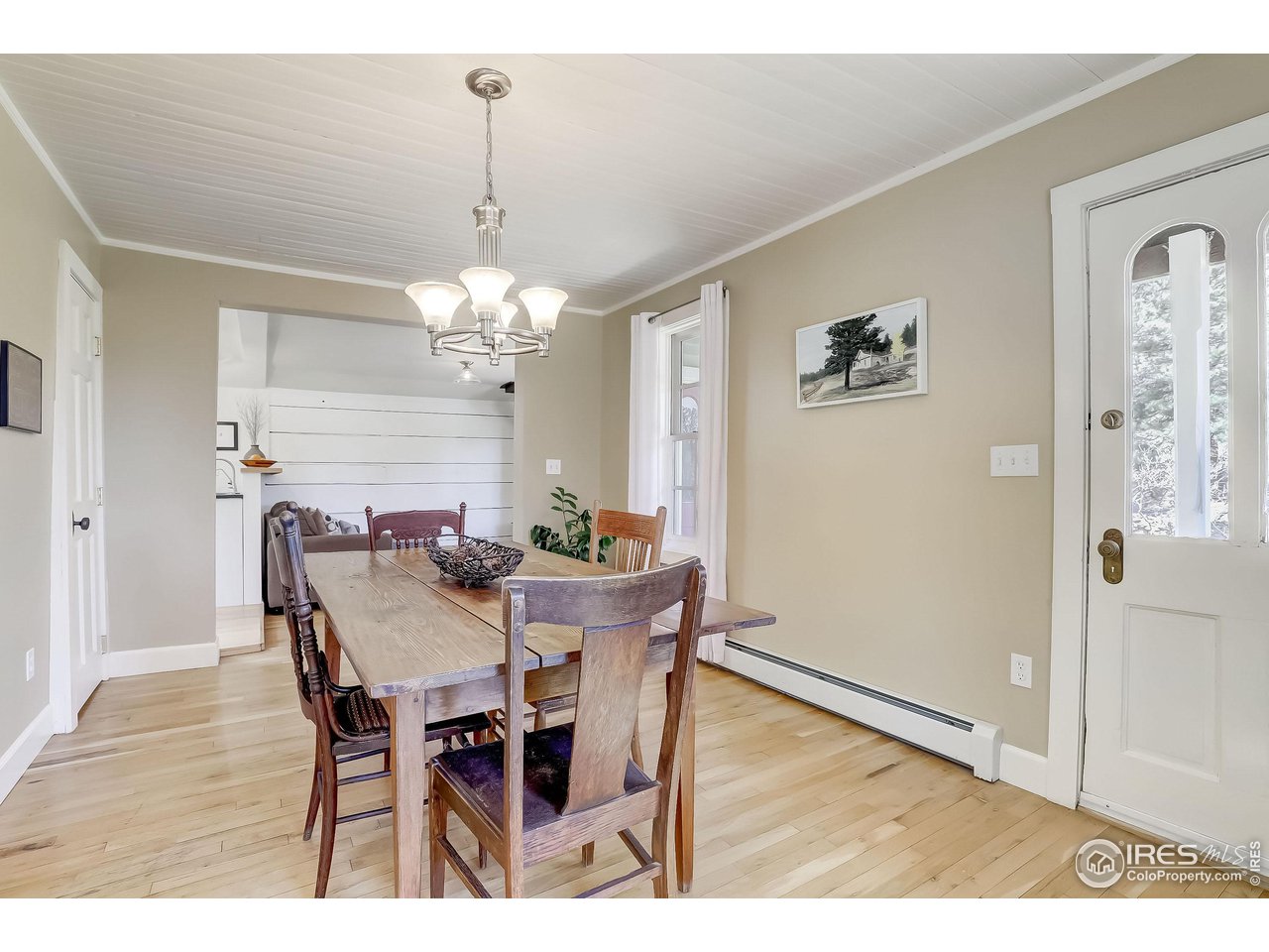 811 County Road 83 Boulder, CO 80302 - Photo 12 of 38 a view of a dining room with furniture and wooden floor